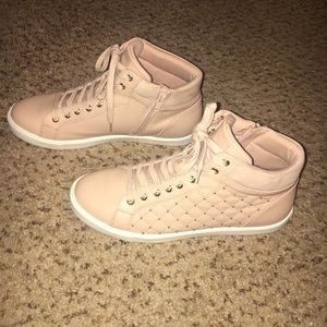 Nude high top sneakers.